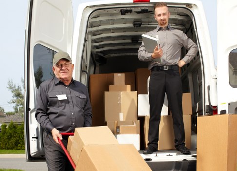 Professional movers loading furniture for a Wapping home move