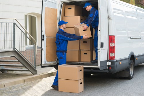 Movers handling business furniture and IT items during a Wapping relocation