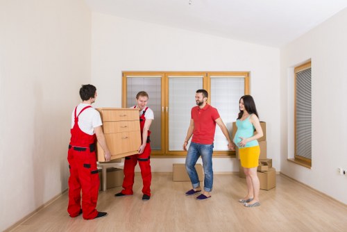 Professional moving team handling boxes in Wapping