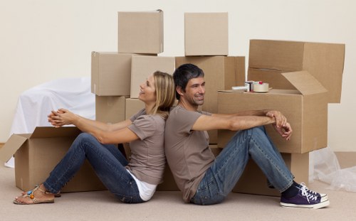 Removals team handling boxes during house removals in Wapping