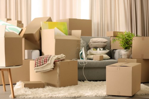 Professional movers handling boxes in a Wapping apartment building